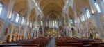 Manchester Cathedral interior with gothic wooden choir and stained glass