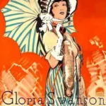 1925年默片《Madame Sans-Gêne》中女主角身穿宮廷服裝站在法國皇宮中的場景